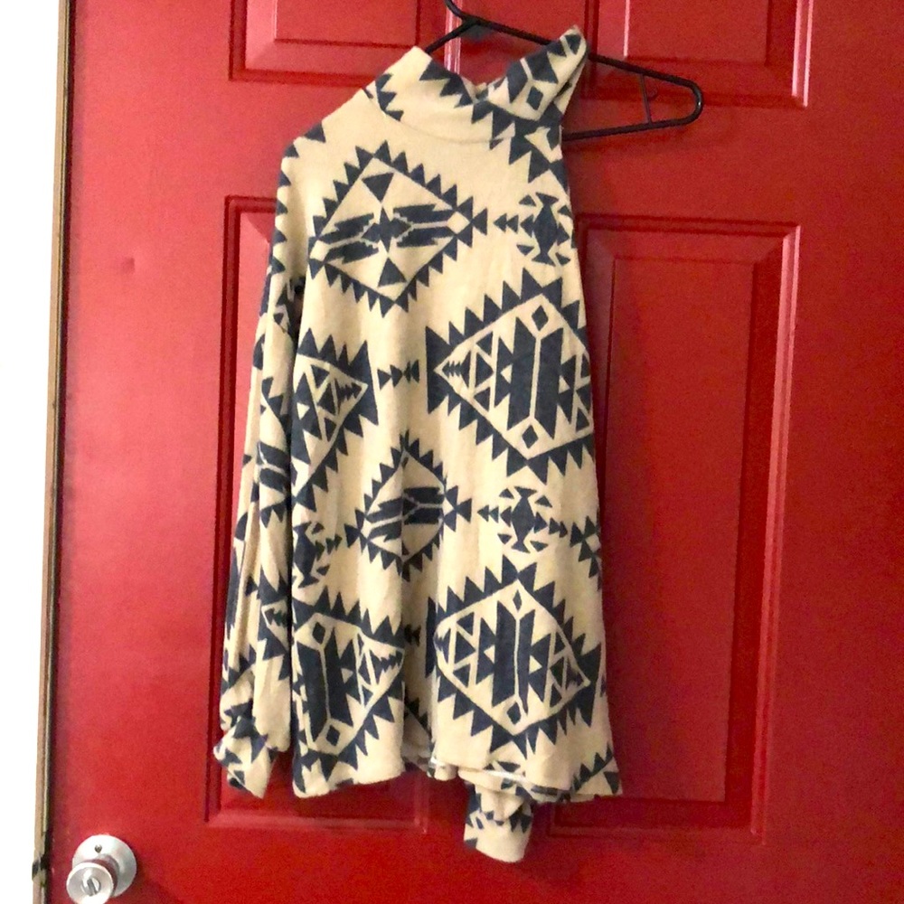 Long sleeve top with cut out shoulder. Never worn, came from a boutique.